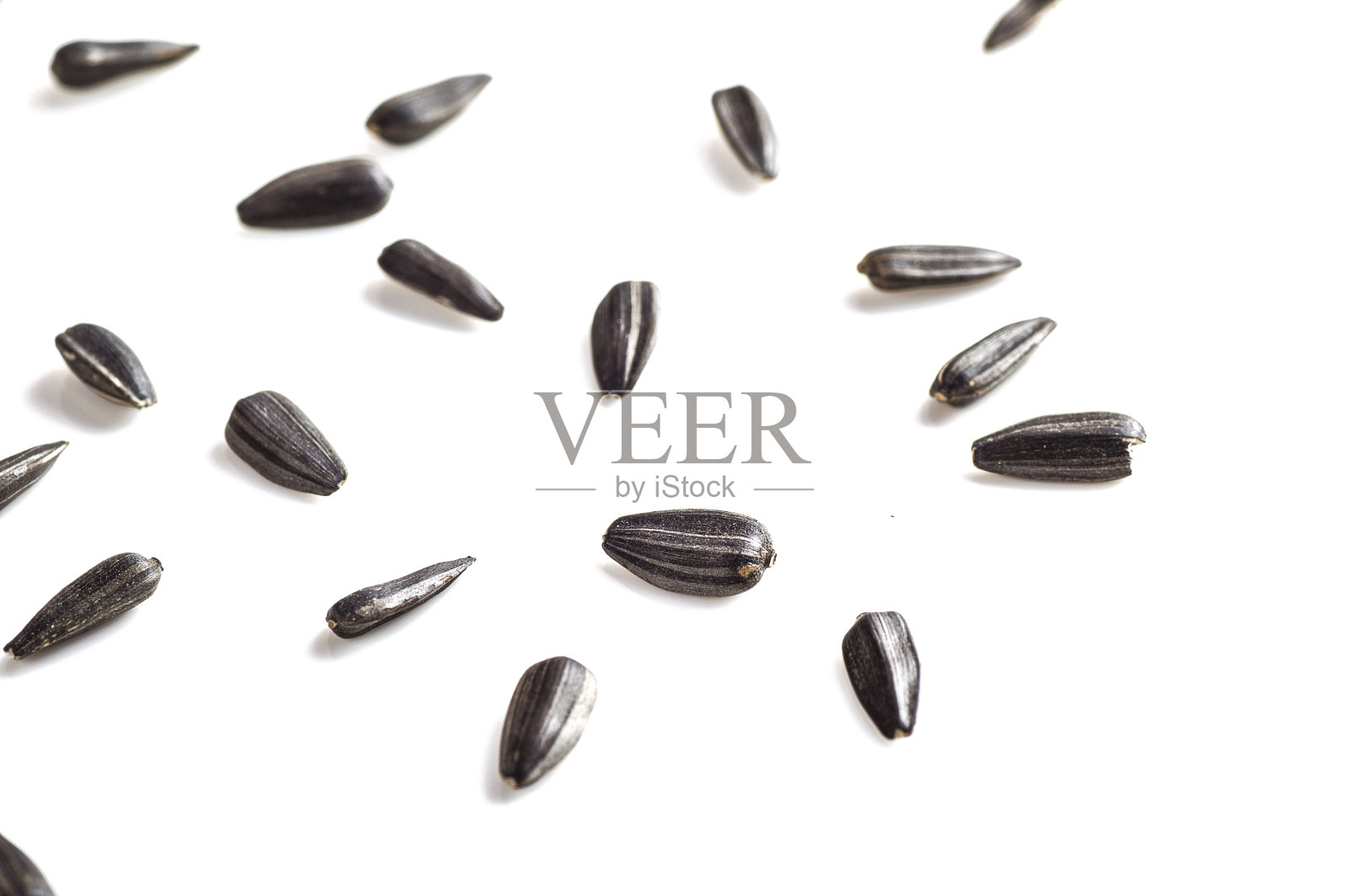 向日葵种子在白色的背景。向日葵。照片摄影图片