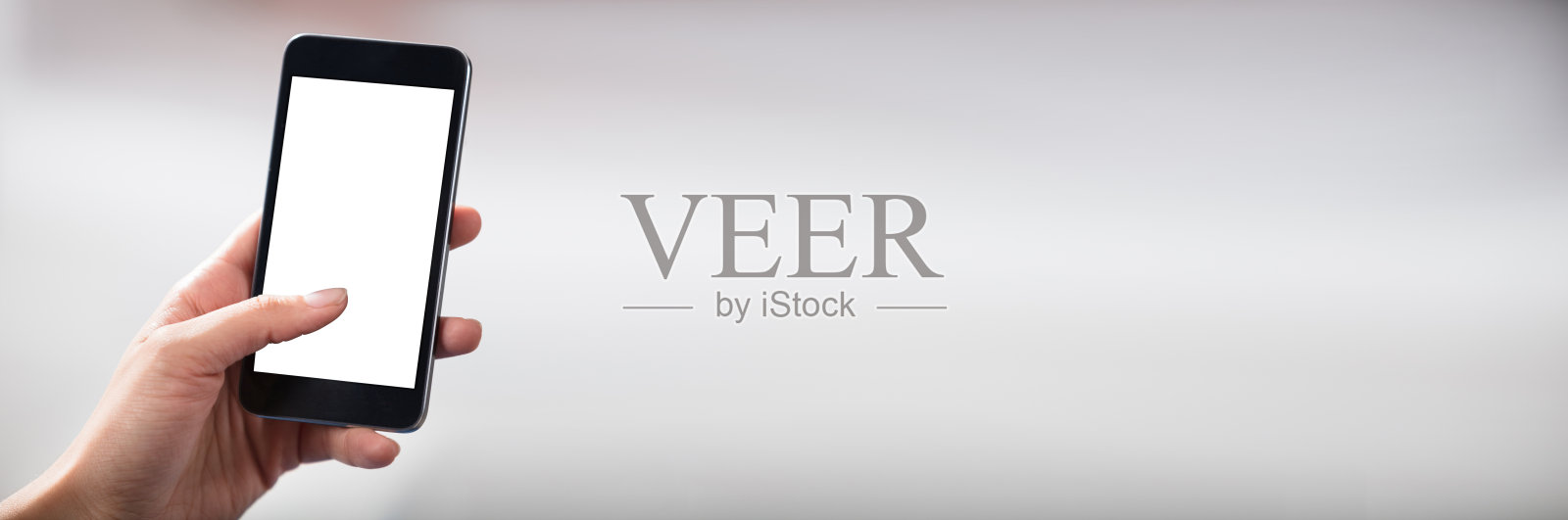 手拿空白屏幕手机照片摄影图片