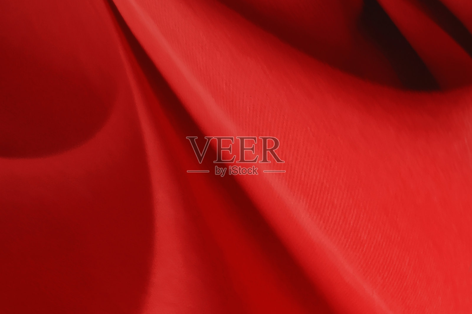 红色织物床单的背景或纹理，抽象与波浪，软焦点布丝绸红色照片摄影图片