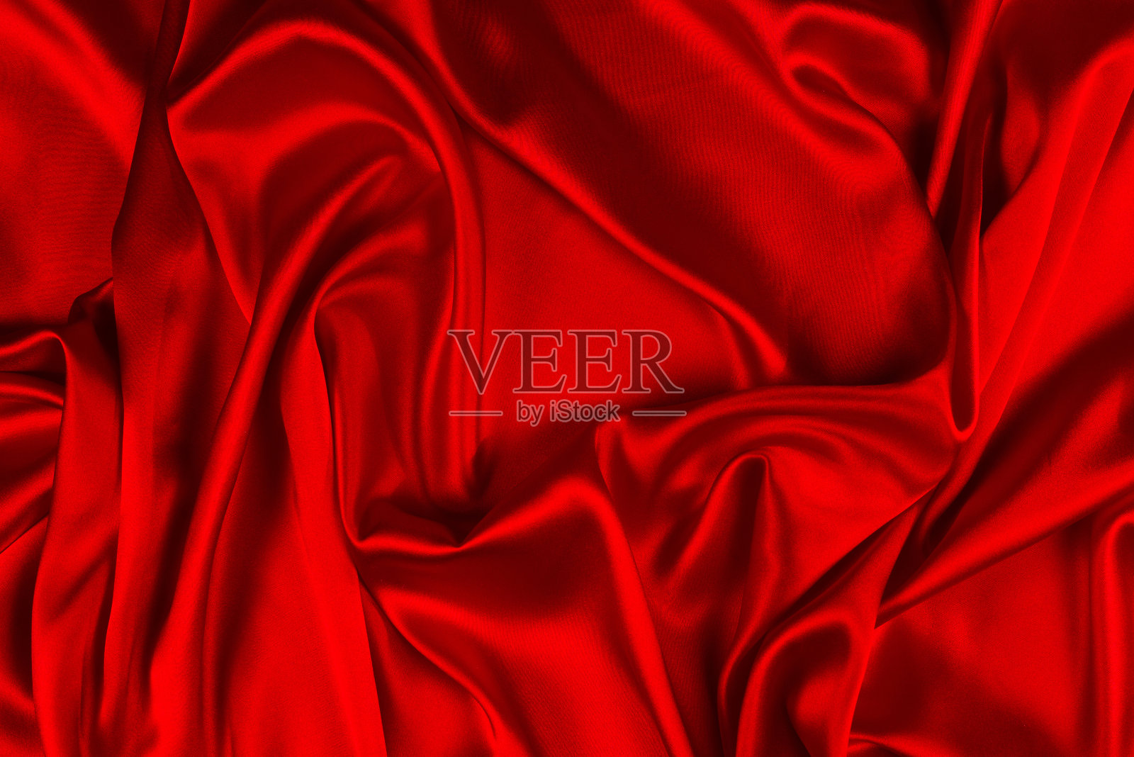 红色丝绸或豪华缎纹织物可作为抽象背景。前视图。照片摄影图片