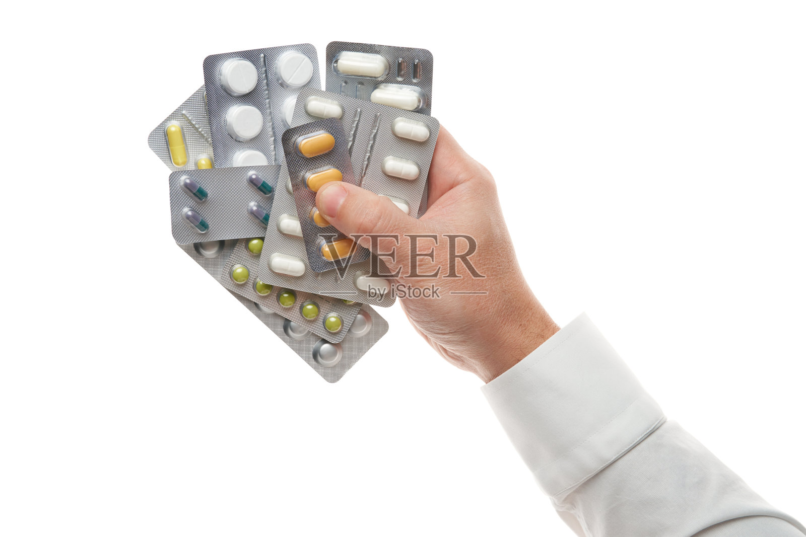 男人的手与药丸水泡孤立在白色的背景。白衬衫，商务风格。保健药品和食品补品。制药行业。药店照片摄影图片