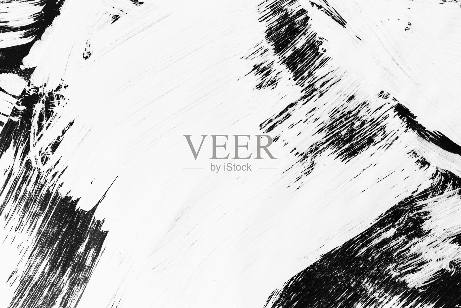 用画笔在黑色背景上画出的白色图案照片摄影图片