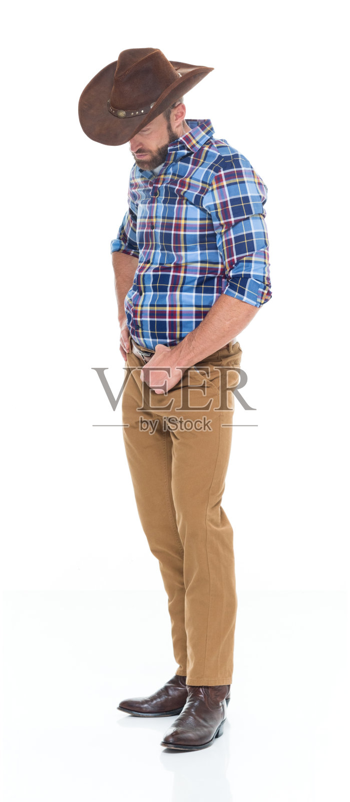 戴帽子的白人男牛仔站立照片摄影图片