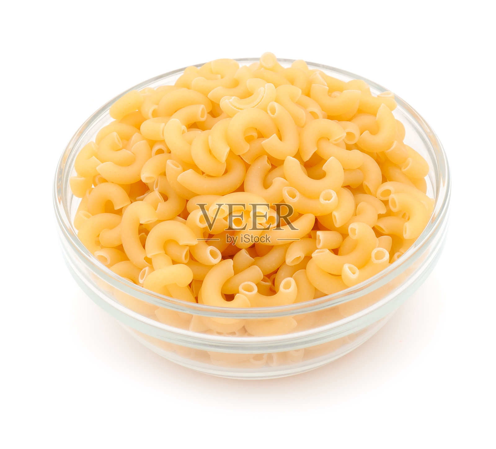 透明碗里的干意大利面。照片摄影图片