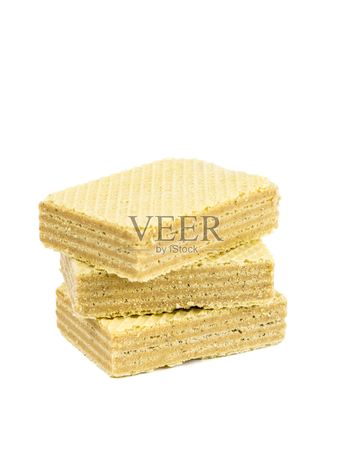 三层隔在白色背景上的甜晶片。照片摄影图片