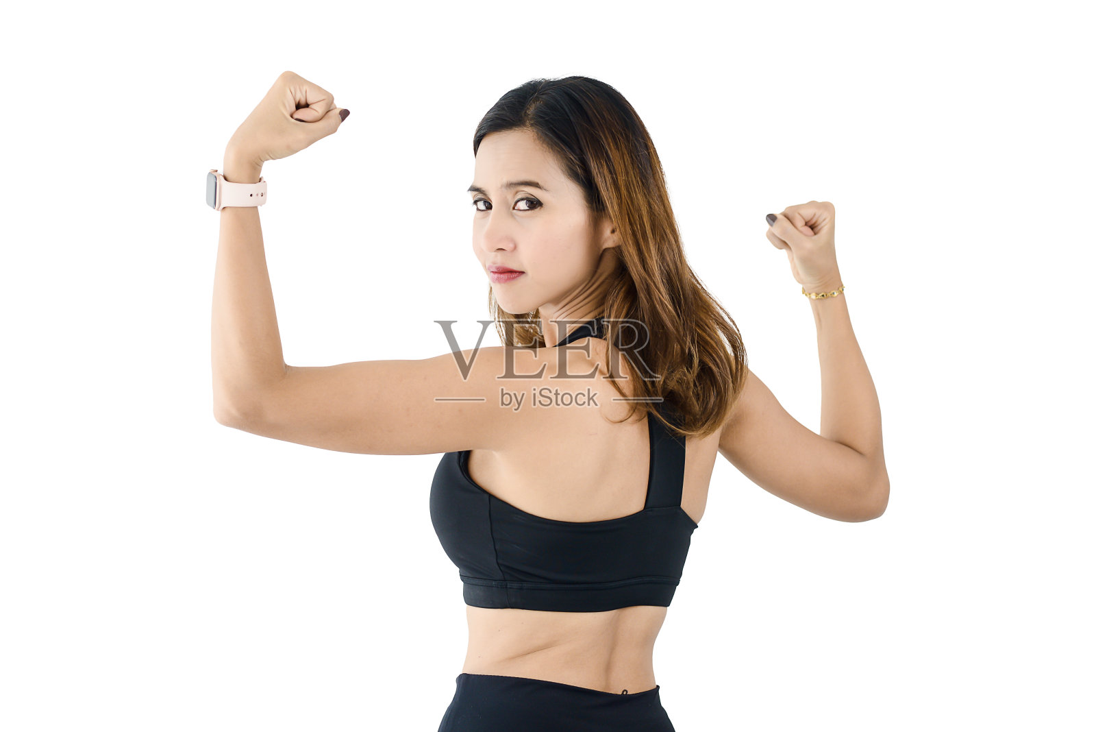 展示肱二头肌和拳头的亚洲运动女性照片摄影图片