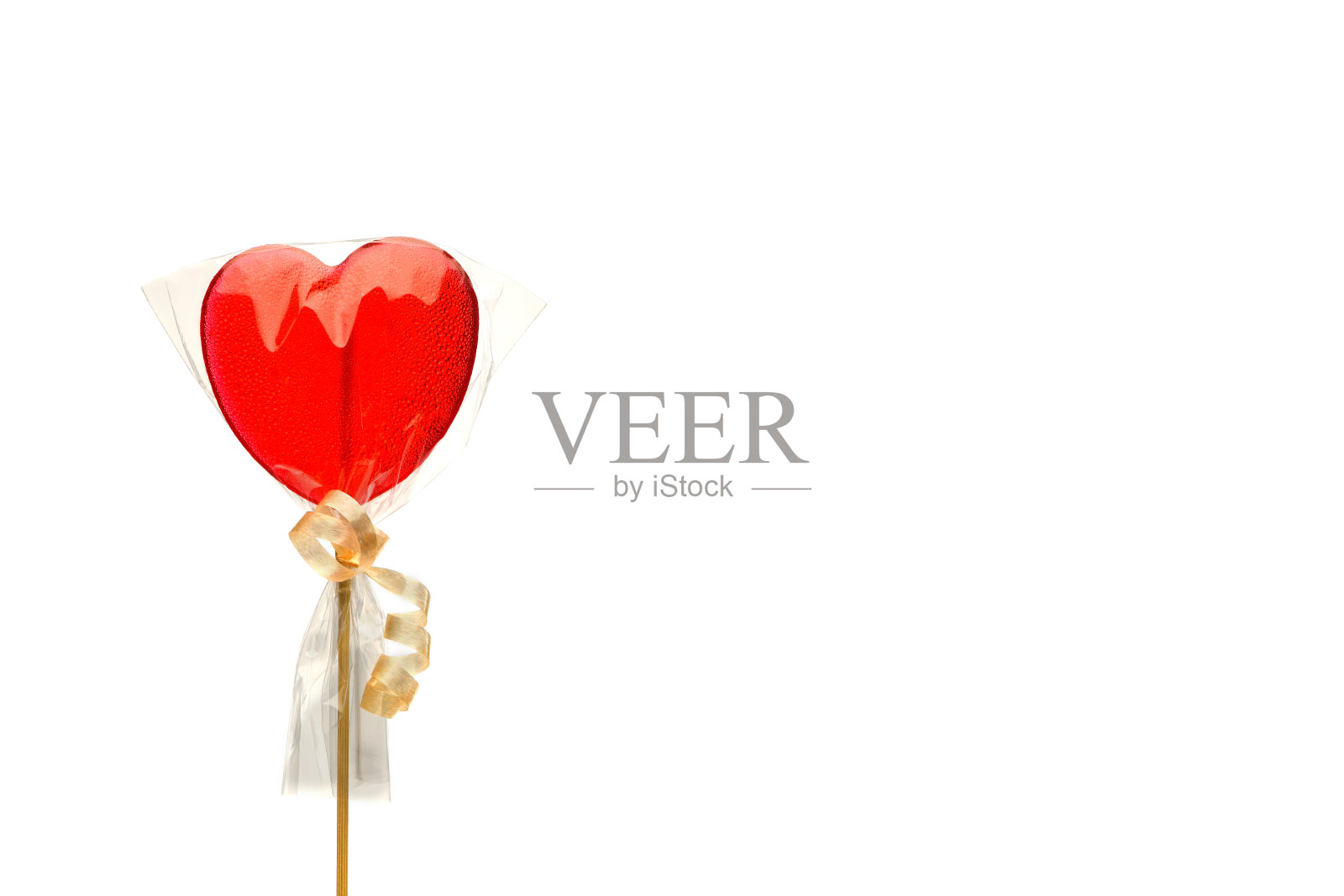 情人节红色心形棒棒糖透明包装，留白文本空间照片摄影图片