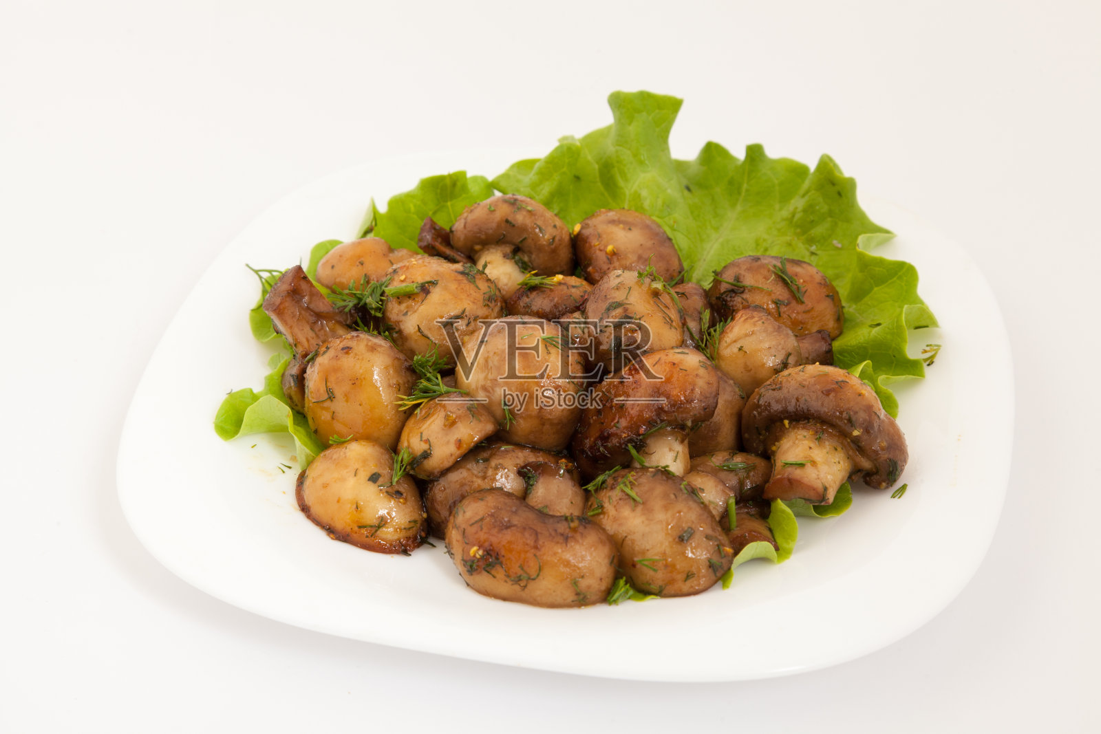 大蒜黄油烤蘑菇和欧芹。从上面照片摄影图片