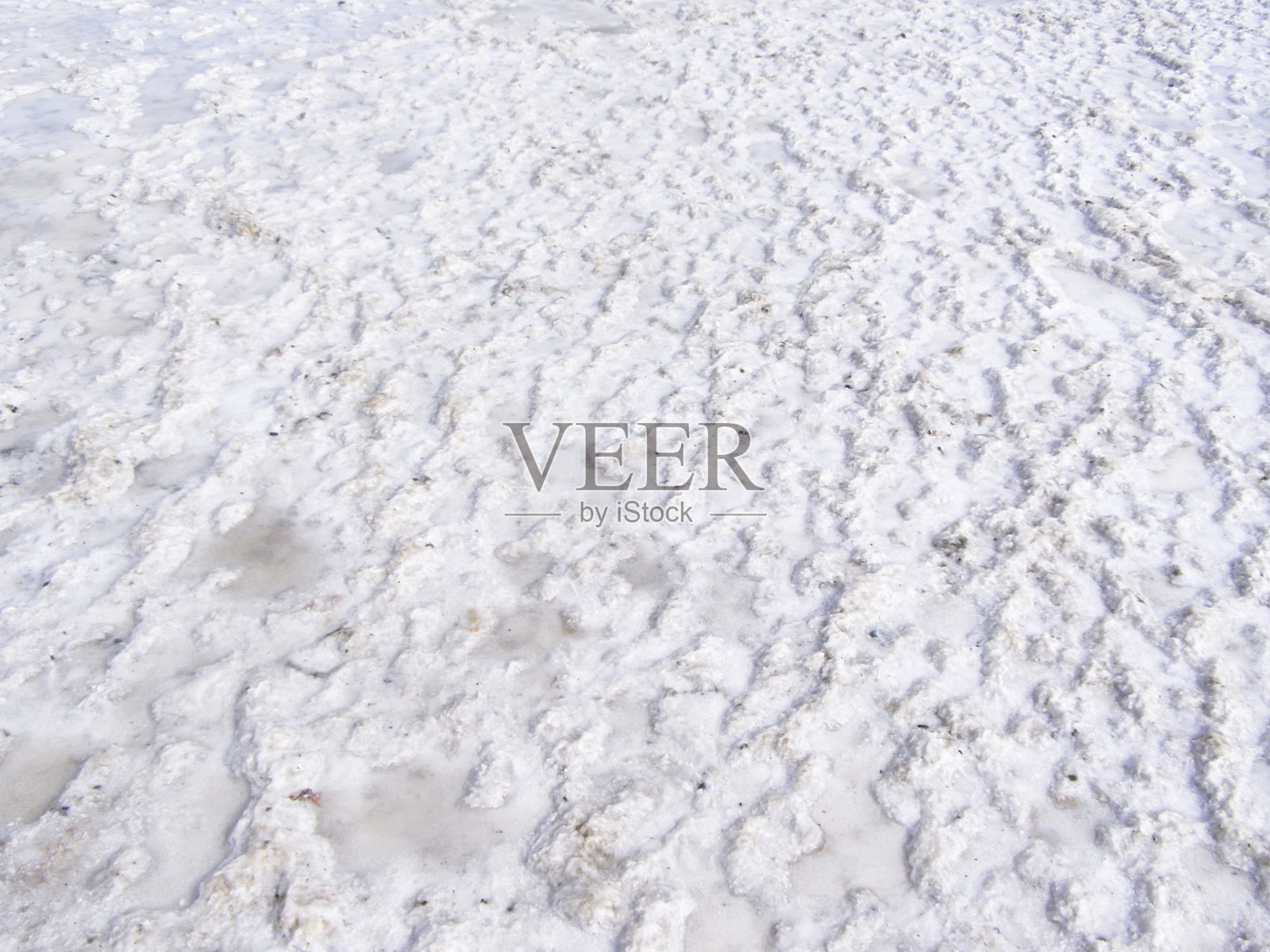 自然白色背景。粒状结晶盐沙漠纹理。照片摄影图片