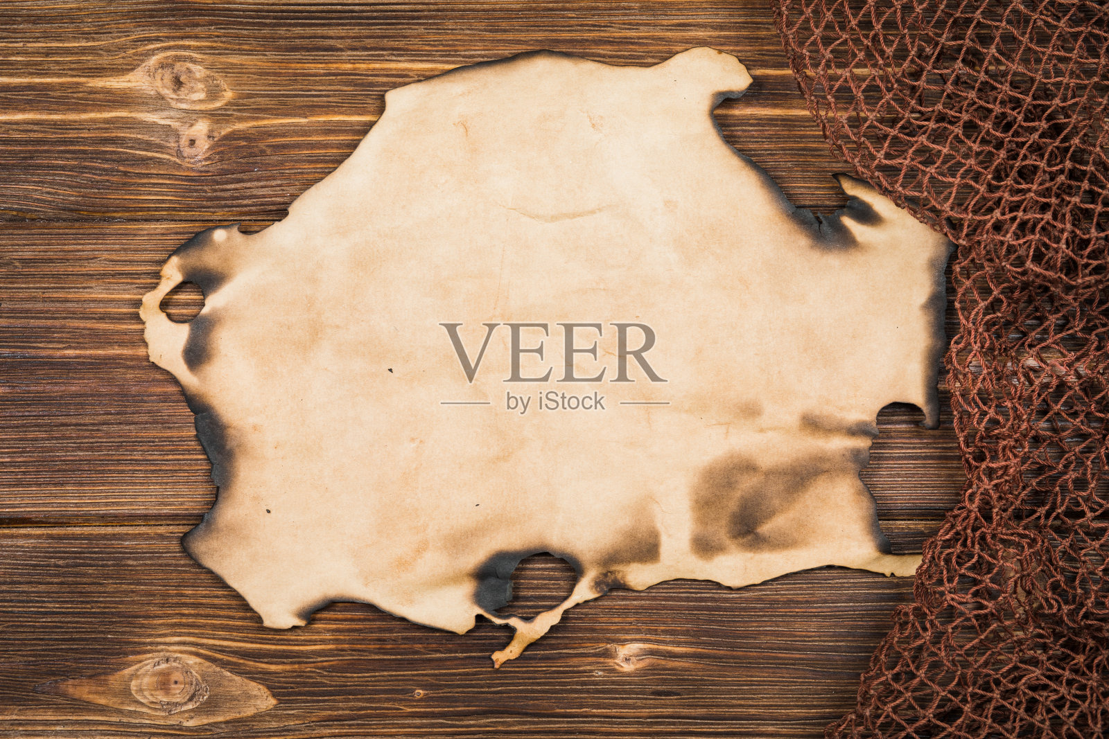 木制背景与旧渔网。照片摄影图片