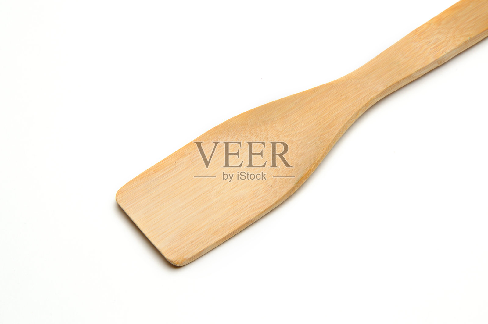 白色背景上的木制厨具抹刀照片摄影图片