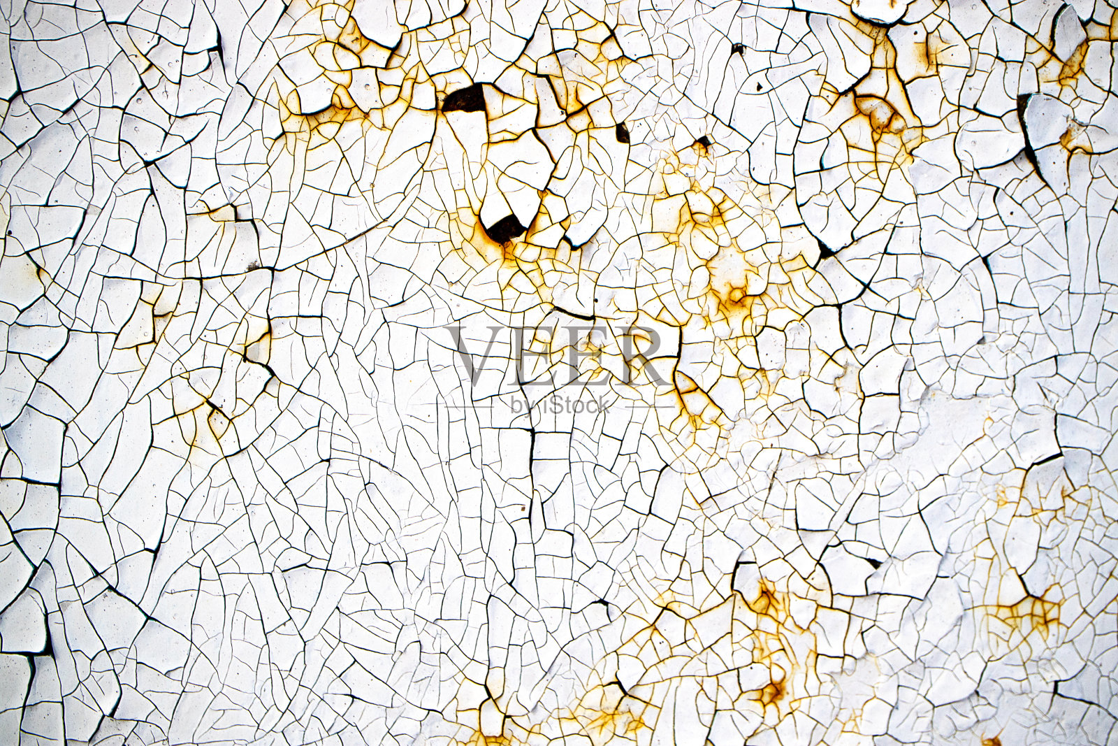 生锈的金属表面被涂上油漆，最终剥落，油漆上的裂缝形成一种纹理照片摄影图片