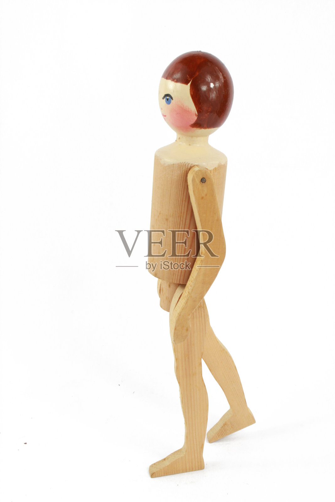 木制雕刻古董娃娃在白色的背景照片摄影图片