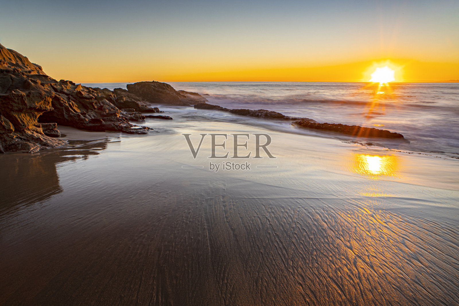 日落海水海滩照片摄影图片