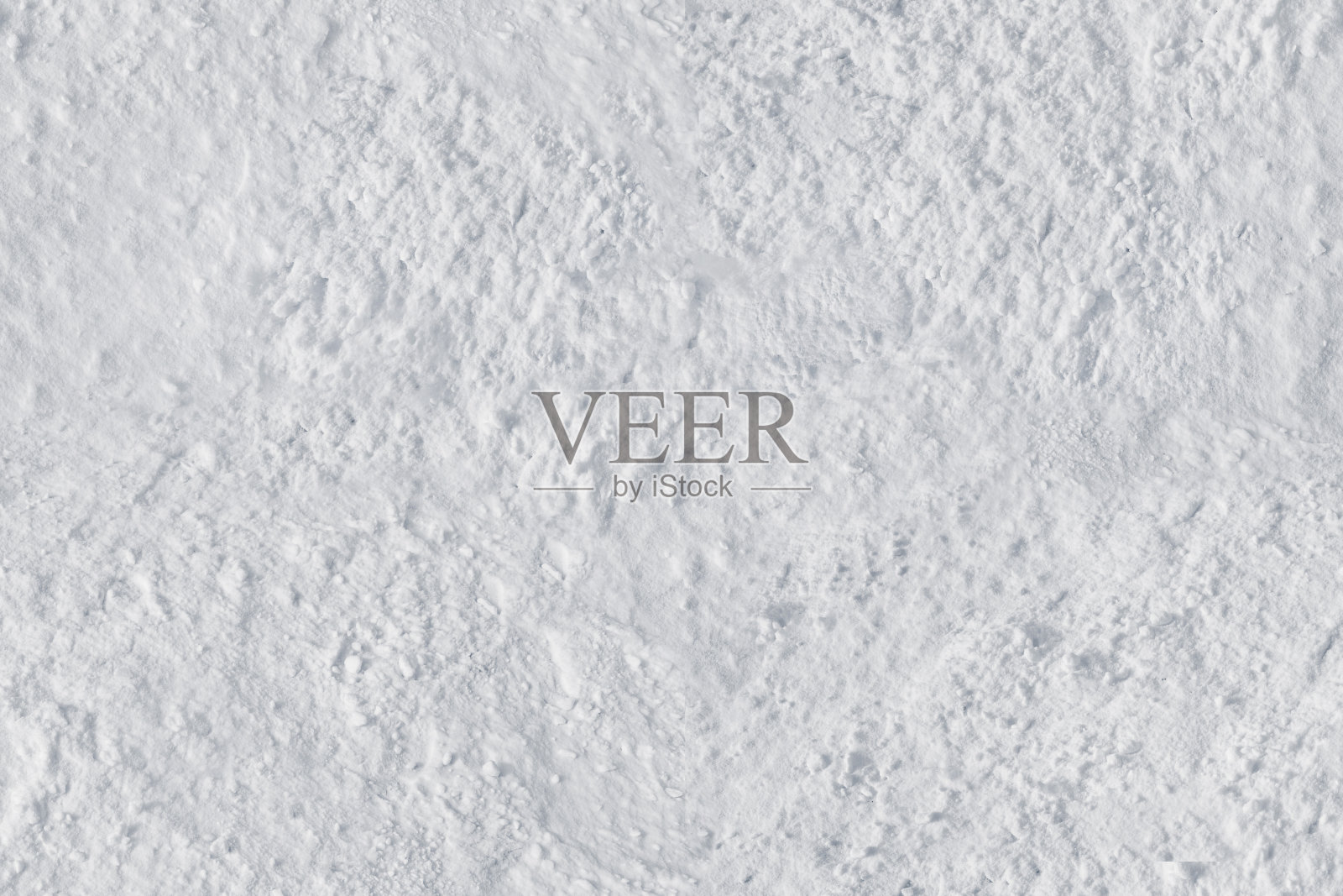 白雪特写带有粗糙的纹理表面。纹理或背景照片摄影图片