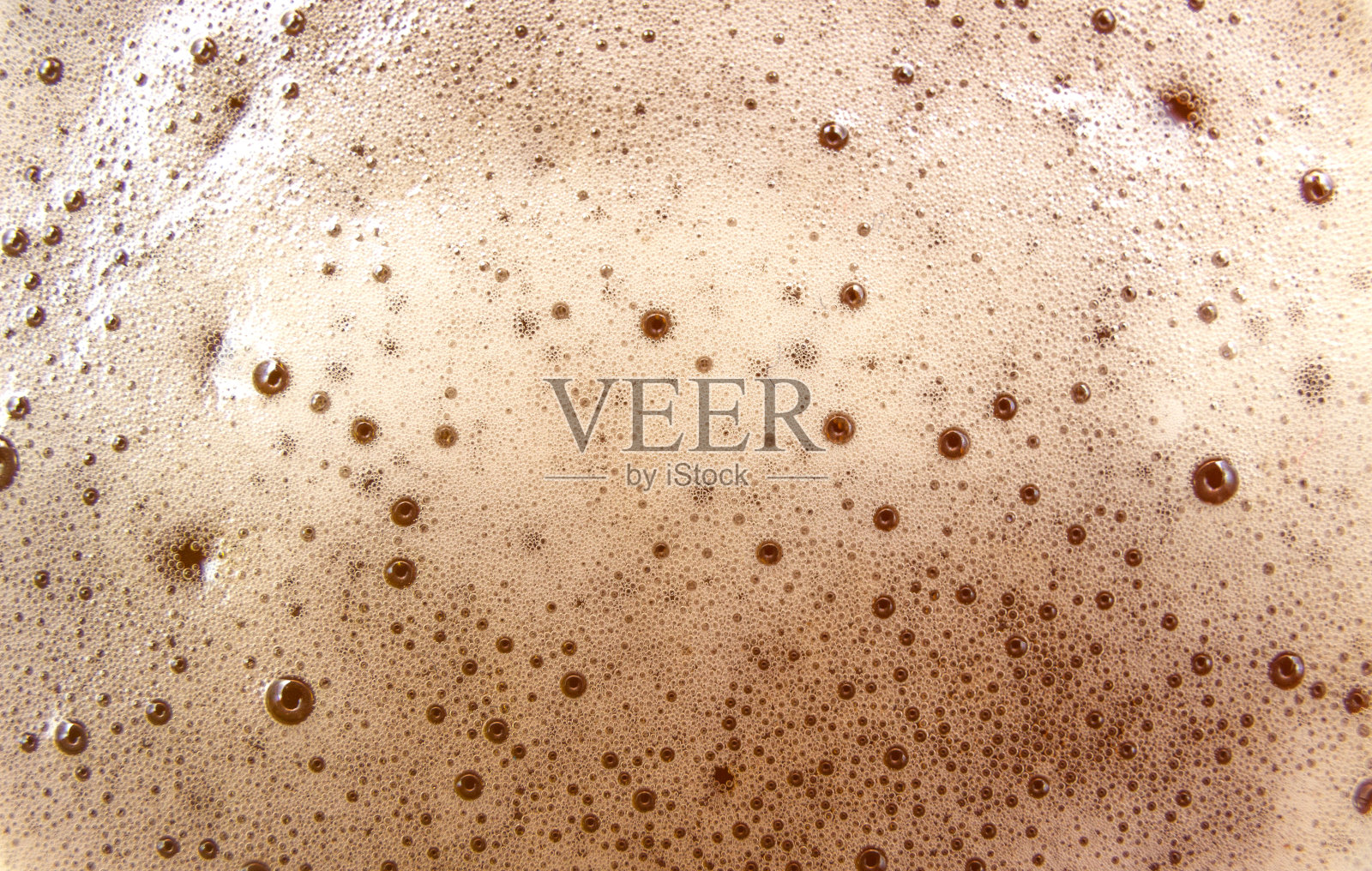 抽象的啤酒泡沫背景。泡沫纹理。照片摄影图片