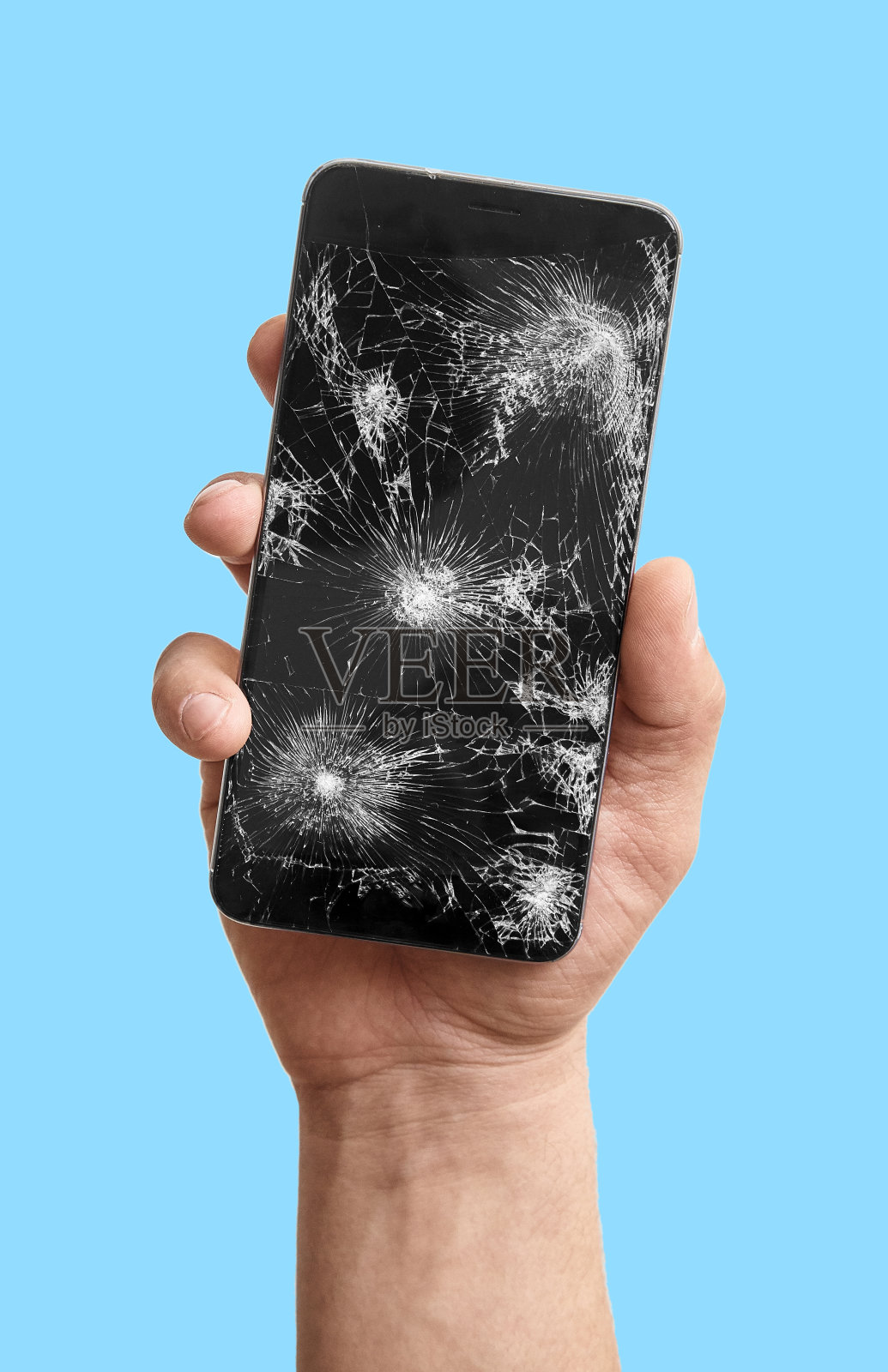 手里拿着坏掉的手机照片摄影图片