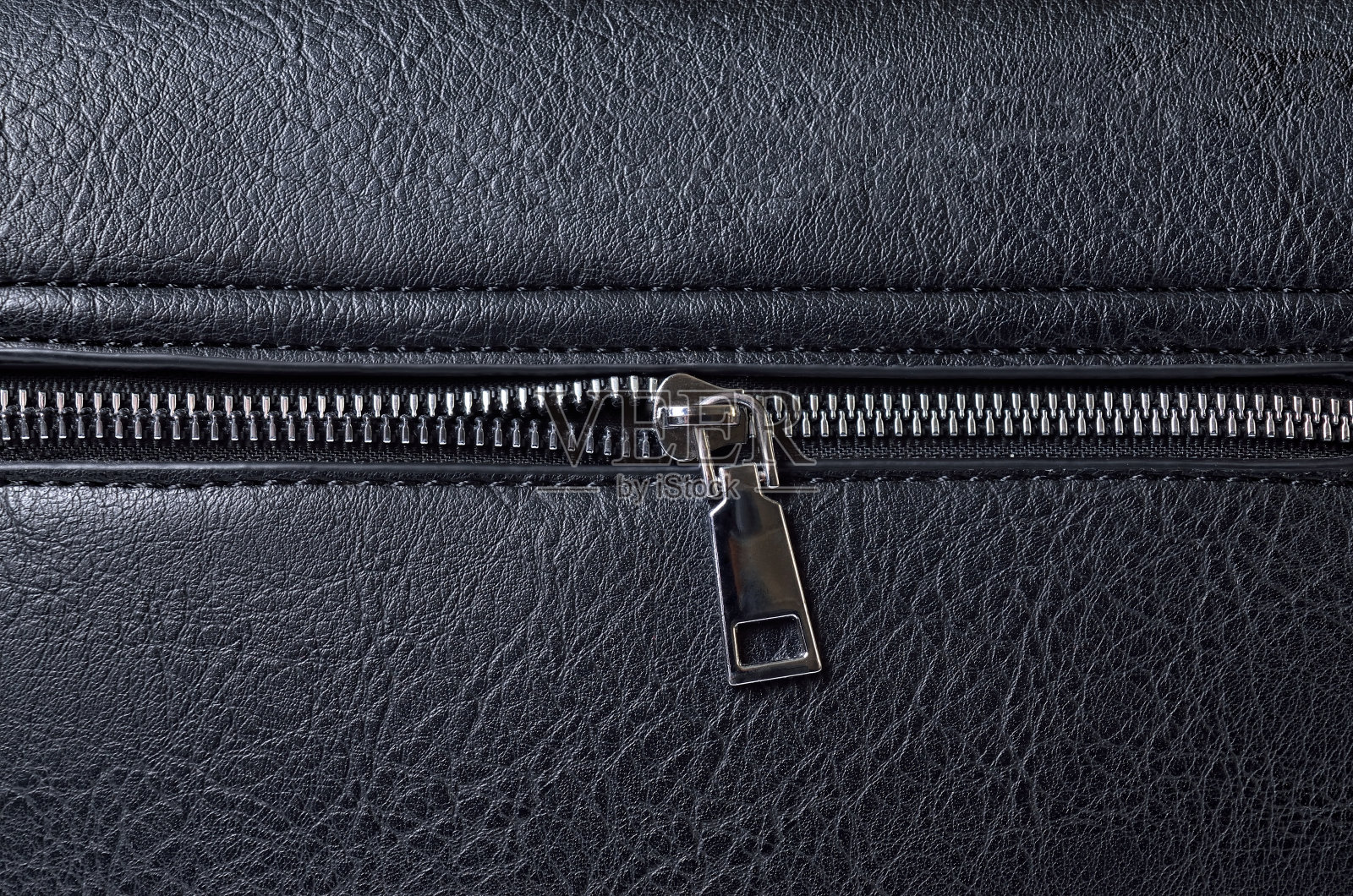 粗糙的黑色动物皮革纹理与拉链照片摄影图片