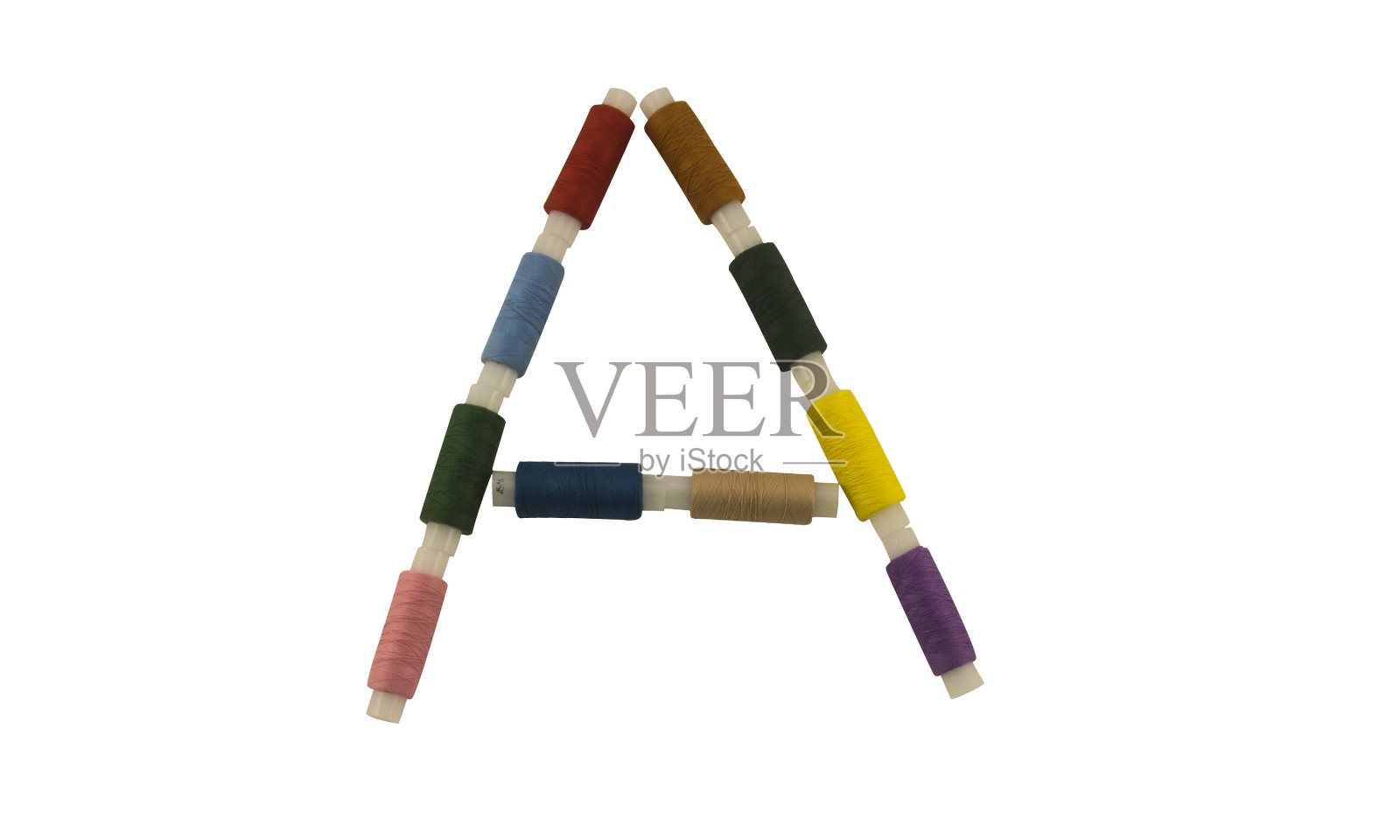 孤立字体英文、拉丁文或俄文字母用于缝纫的彩色线轴照片摄影图片