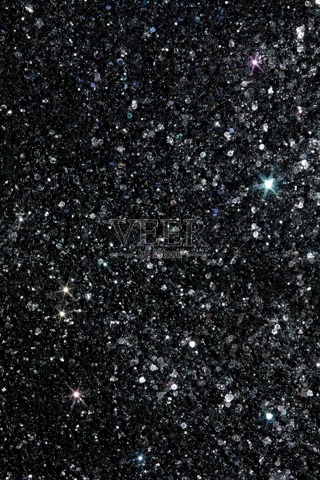 黑色闪亮闪烁的背景，纹理喜庆闪烁着不同的颜色照片摄影图片