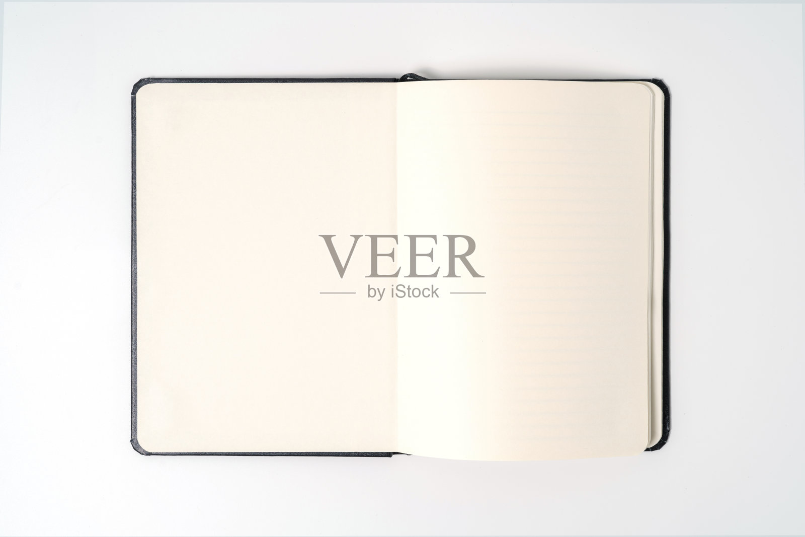 黑色笔记本上的白色背景与剪切路径照片摄影图片