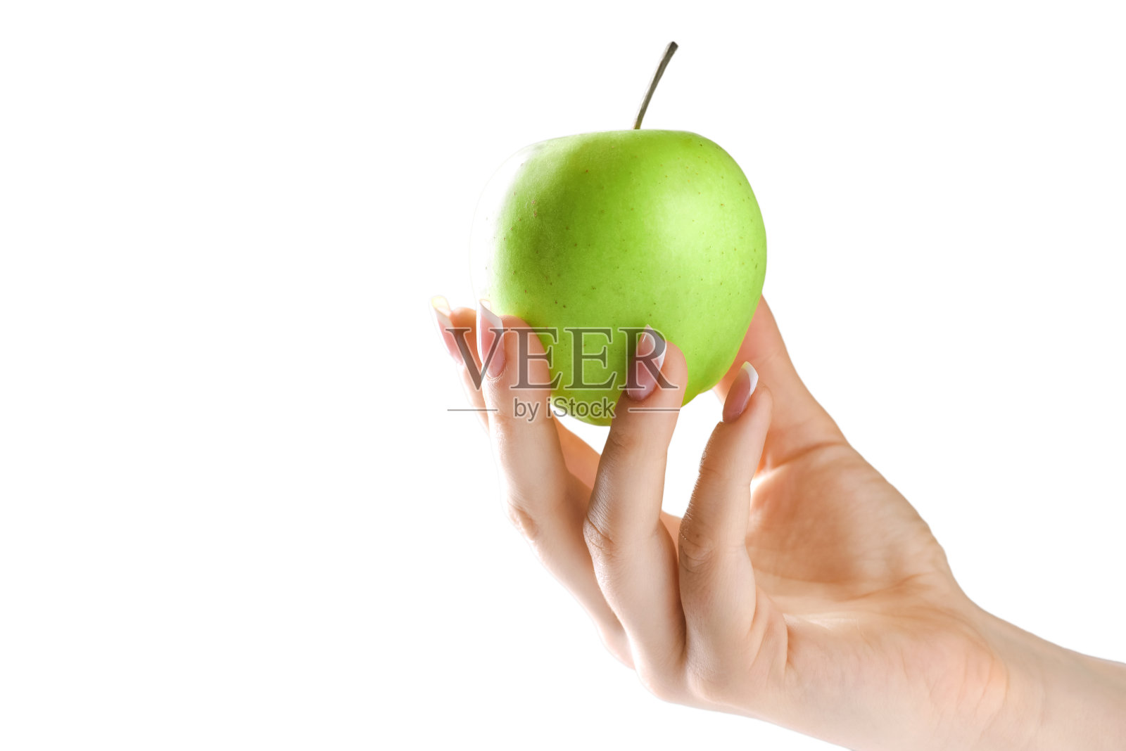 女人手里拿着新鲜的绿苹果。照片摄影图片