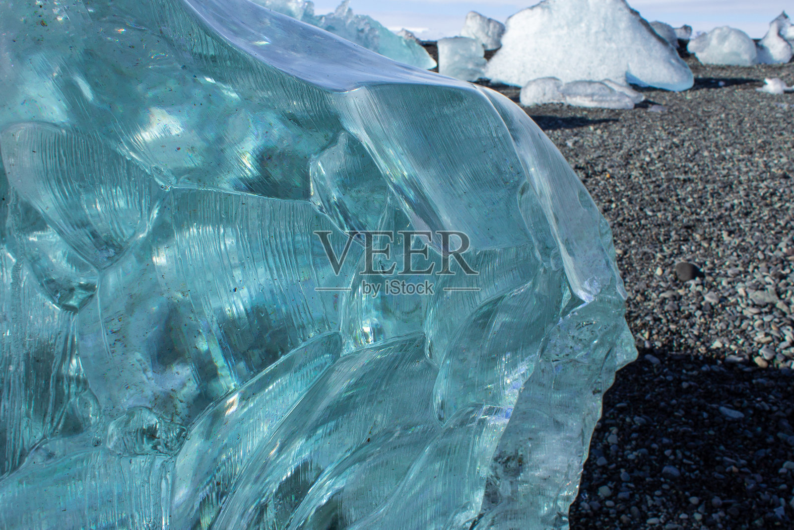 冰岛海岸黑色卵石滩上的冰原照片摄影图片