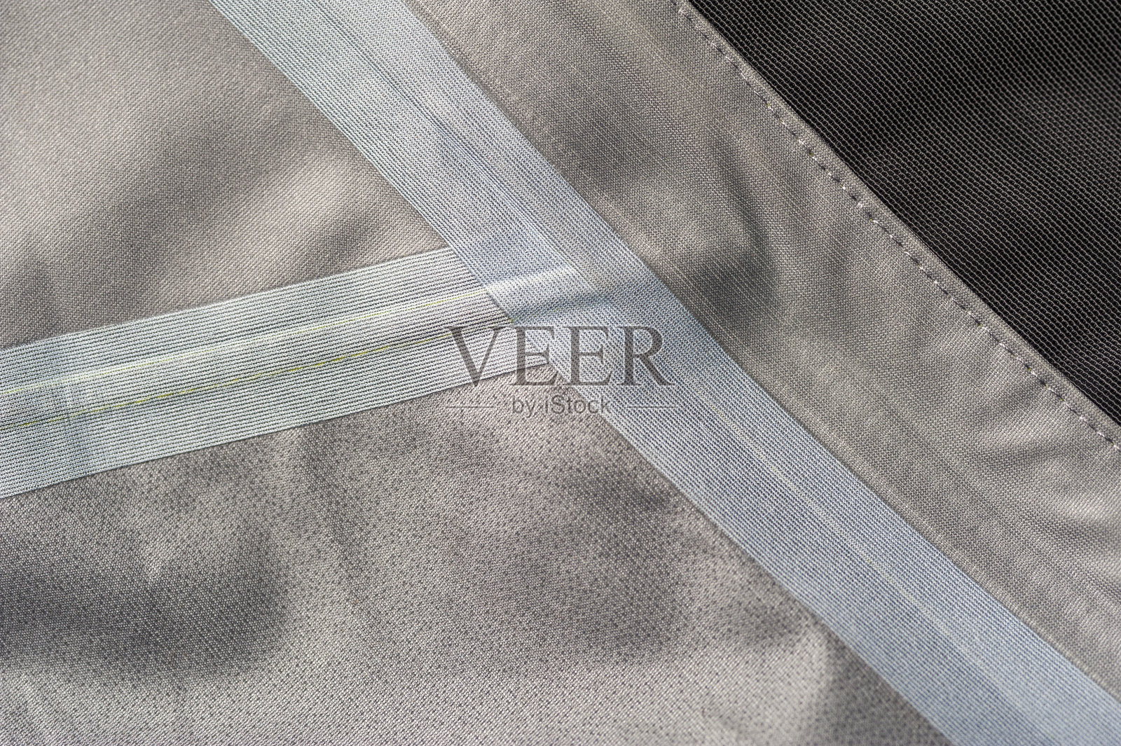 一件绿灰色夹克里面的碎片照片摄影图片