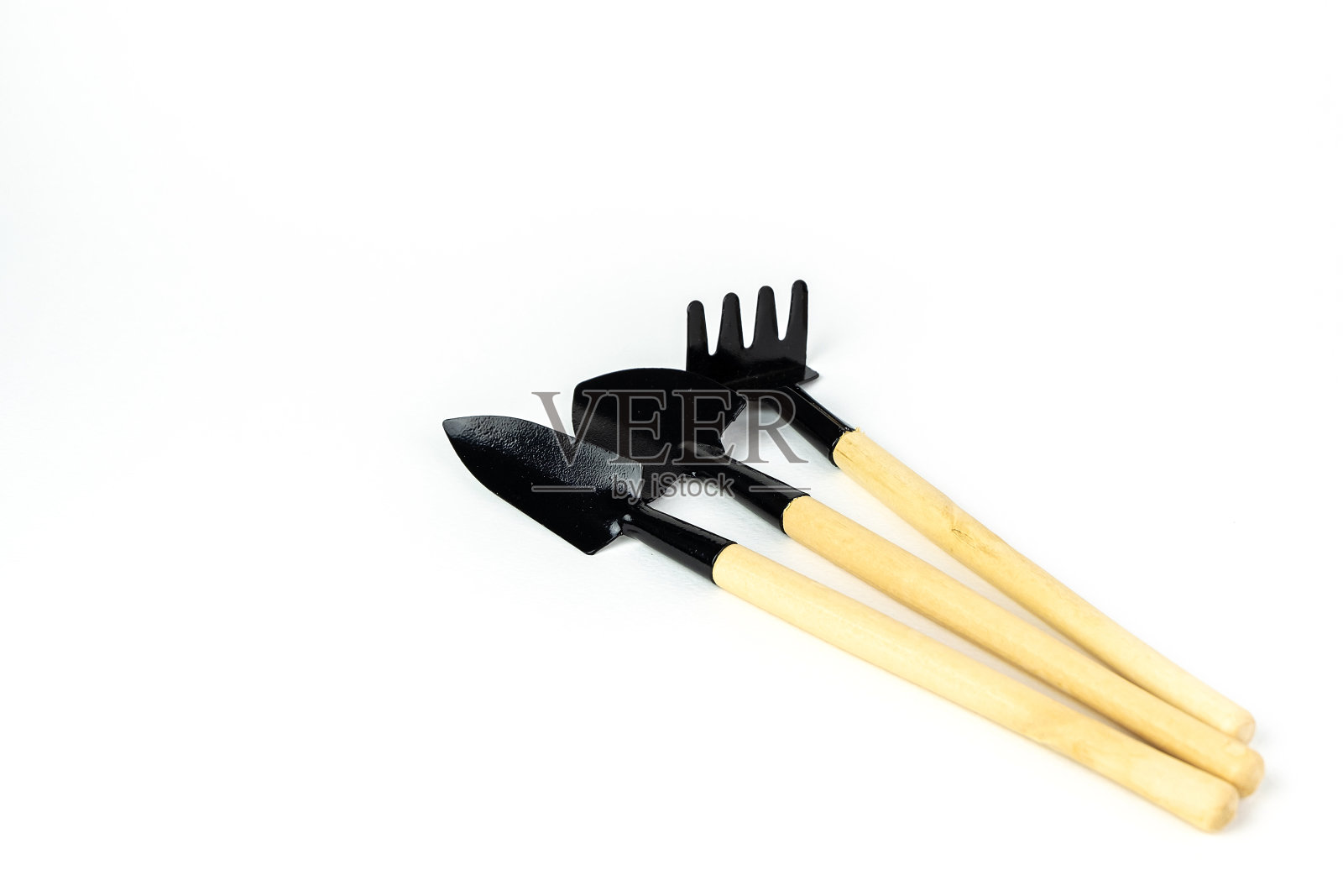 迷你耙子和铲子盆园艺。孤立在白色背景上。近距离射杀。与复制空间。“n照片摄影图片