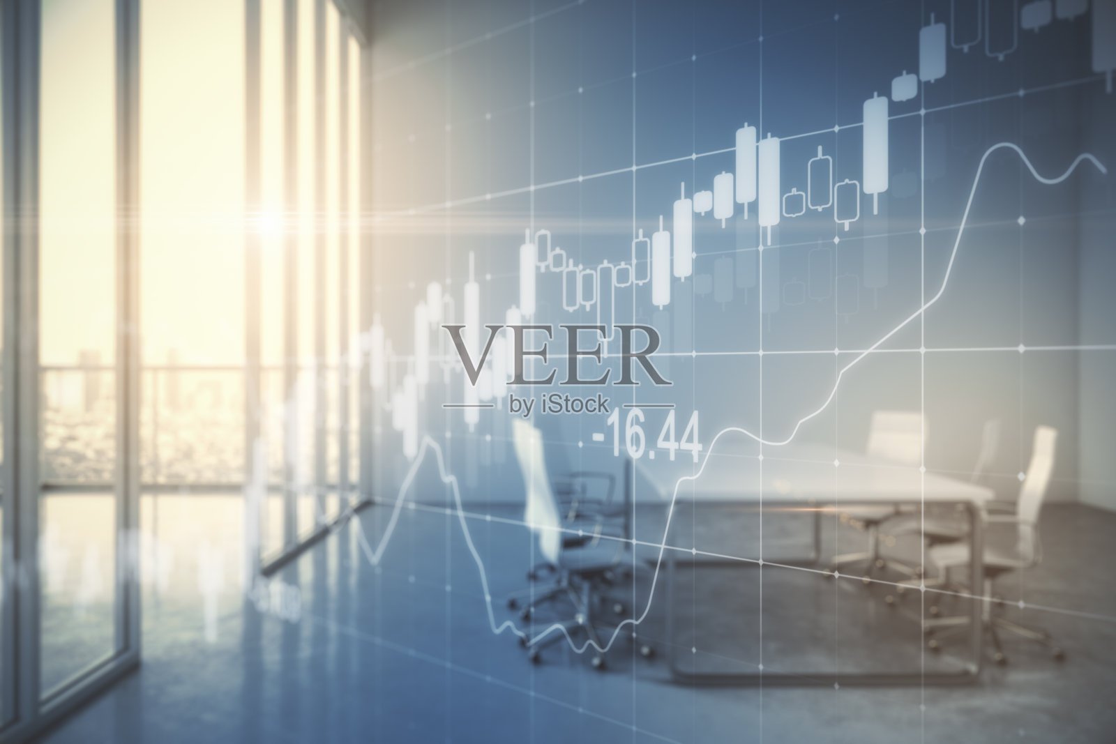 内部与计算机和股票图表协同工作。照片摄影图片