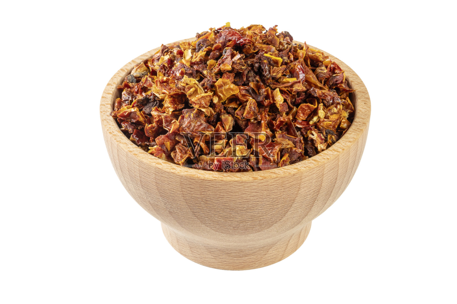 干西红柿在木碗孤立在白色背景。香料及食物配料照片摄影图片