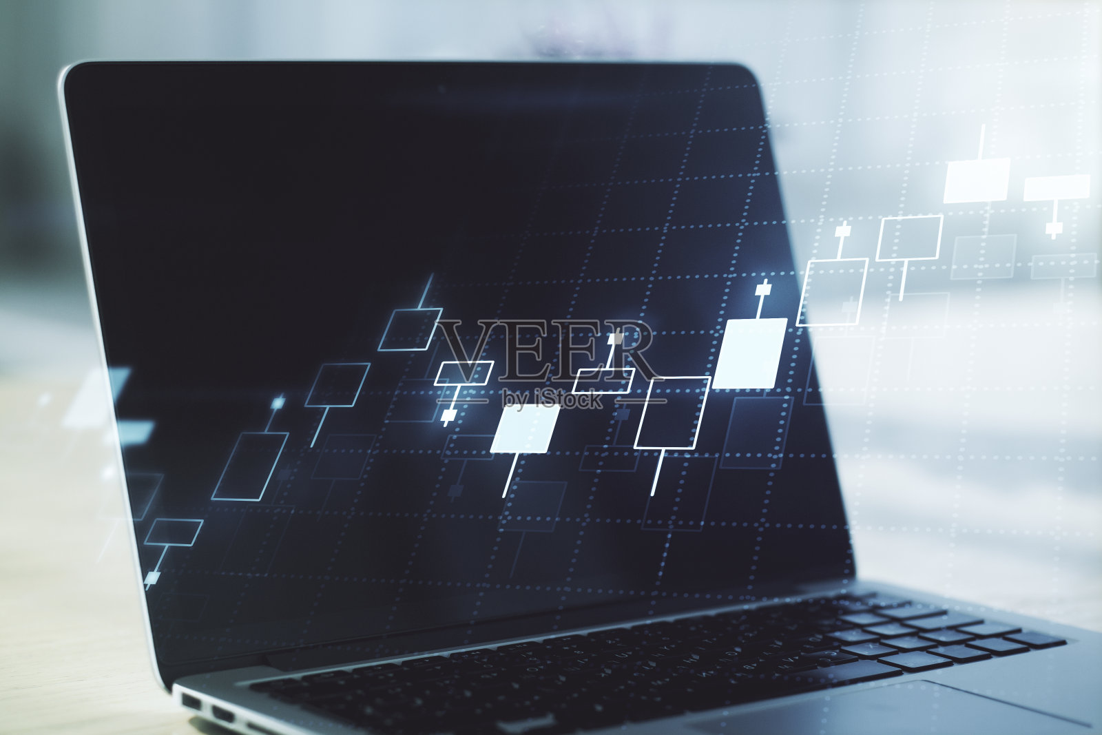 抽象创意金融图形，以现代笔记本电脑为背景，阐述外汇与投资的概念。Multiexposure照片摄影图片