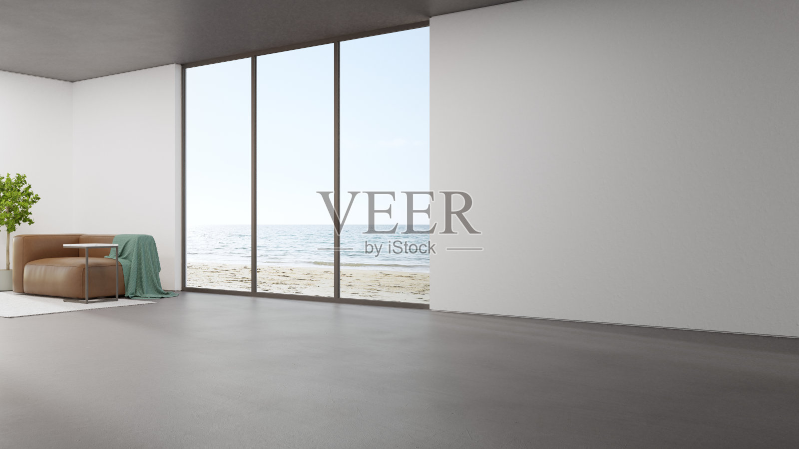 现代住宅或豪华酒店大客厅混凝土地板上的沙发。照片摄影图片