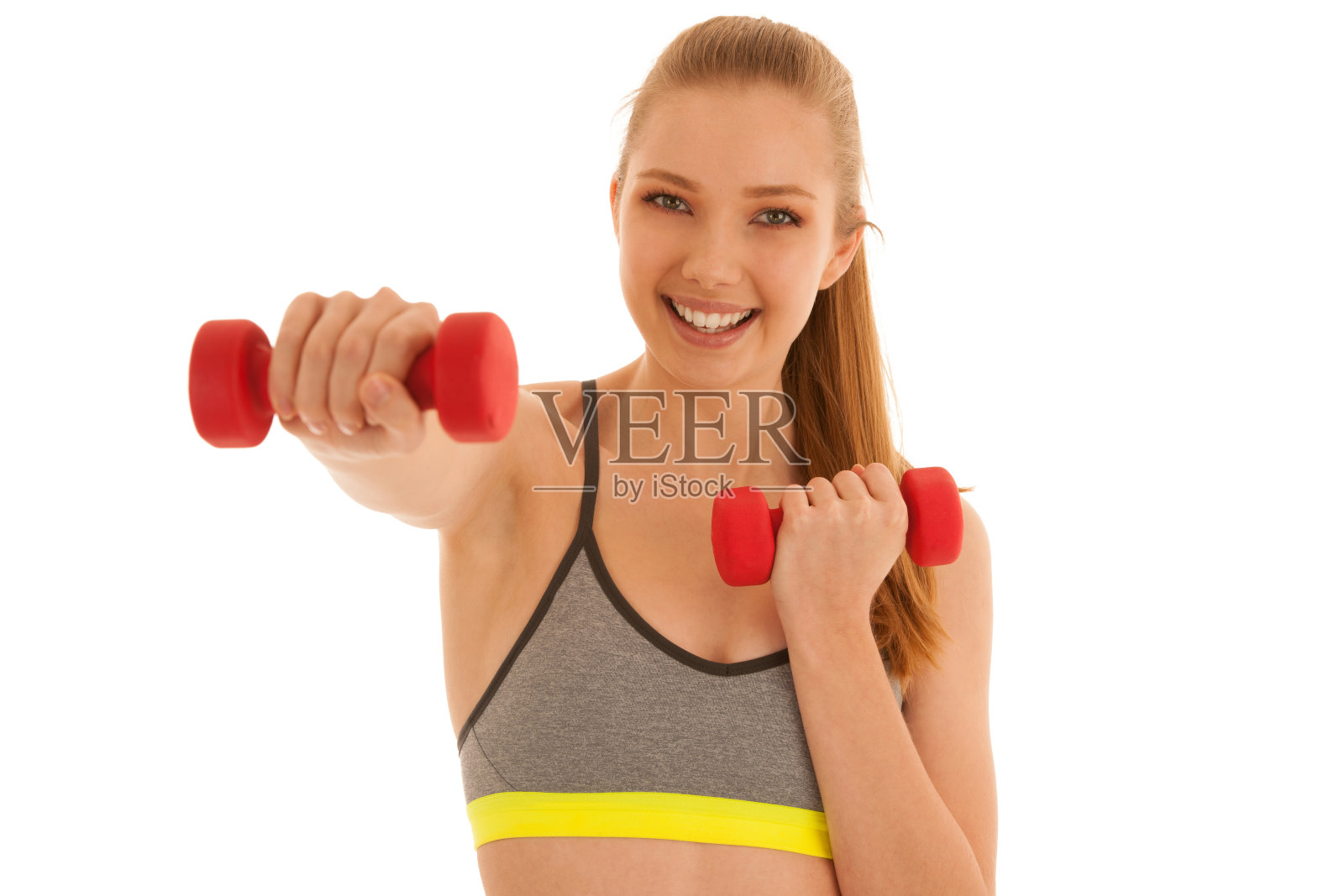 美丽的年轻健康的女人运动与哑铃隔离在白色的背景照片摄影图片