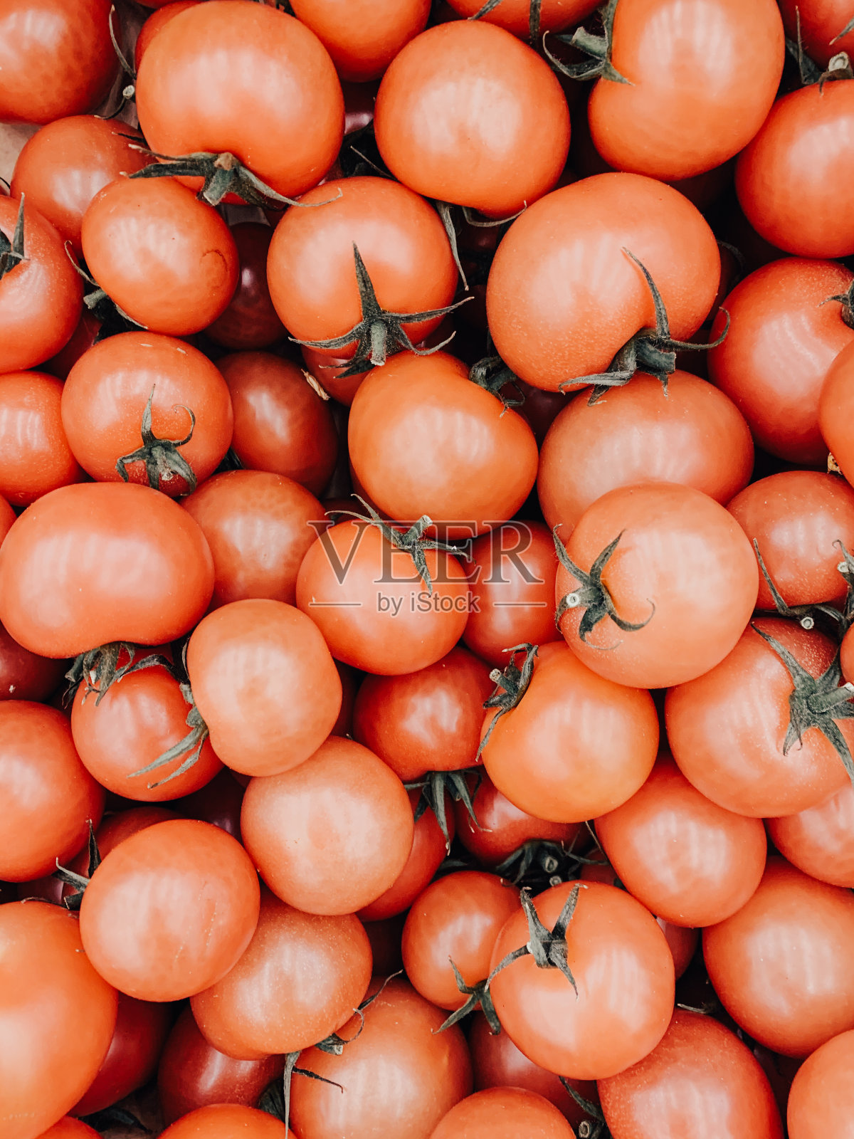 大量的红色成熟的西红柿吃，就像一个背景照片摄影图片