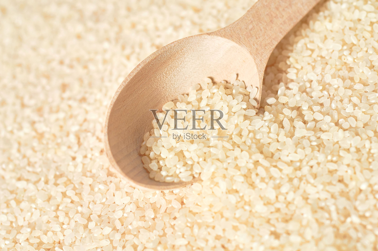 木勺配白米粒照片摄影图片