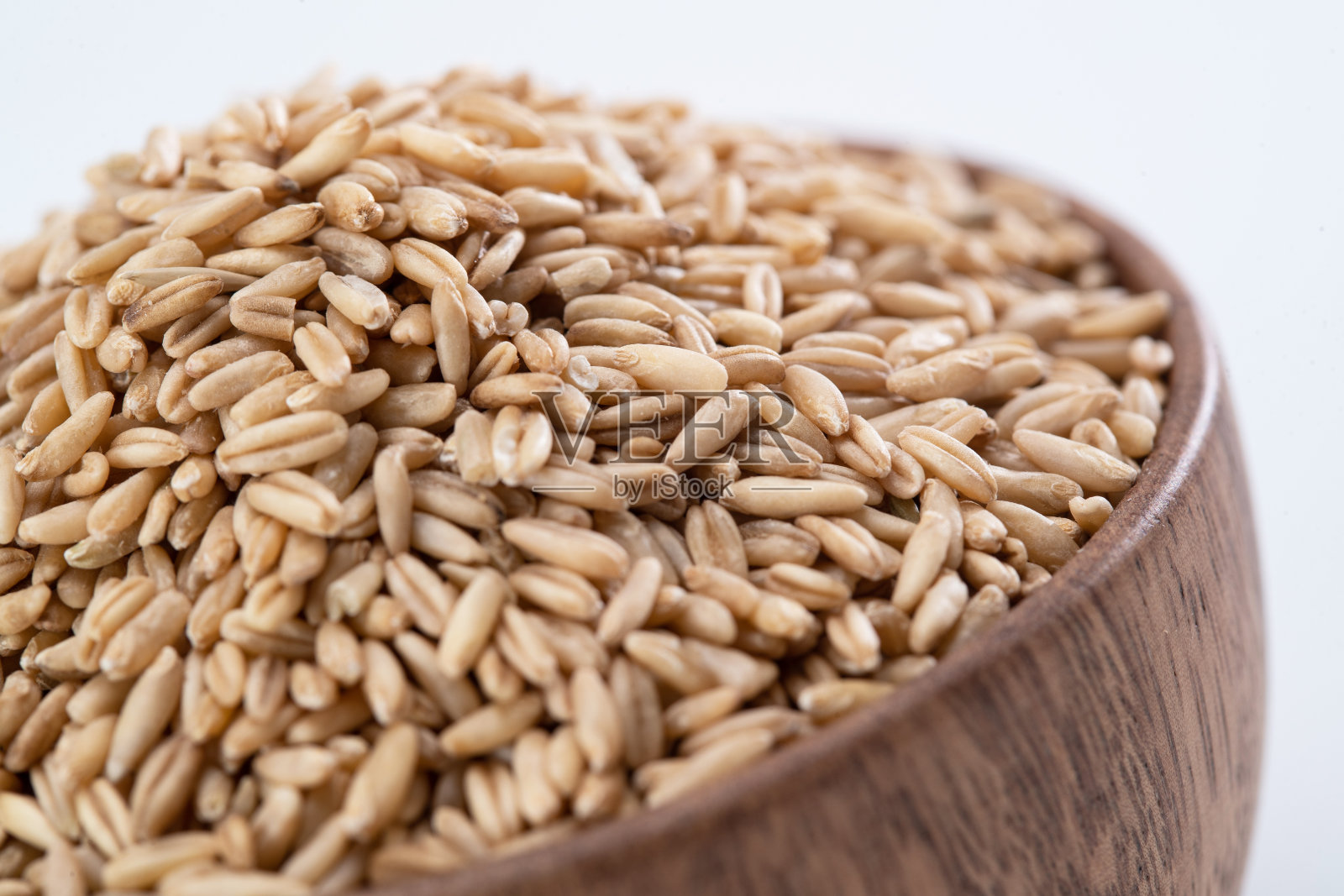 木碗装满燕麦米照片摄影图片