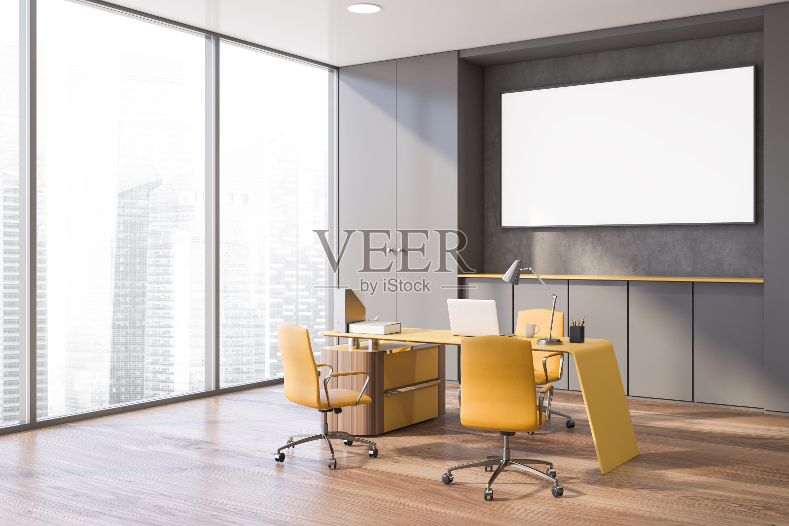 灰色老板办公室角落贴着海报照片摄影图片