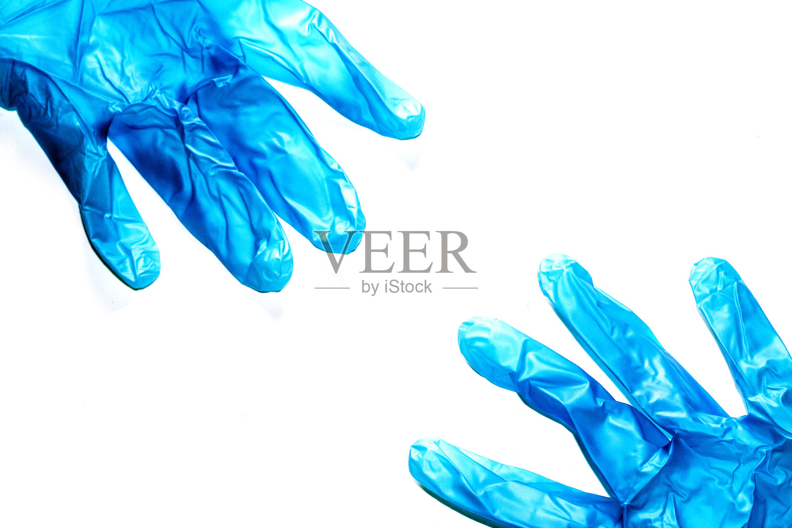 蓝色医用乳胶手套防护病毒照片摄影图片