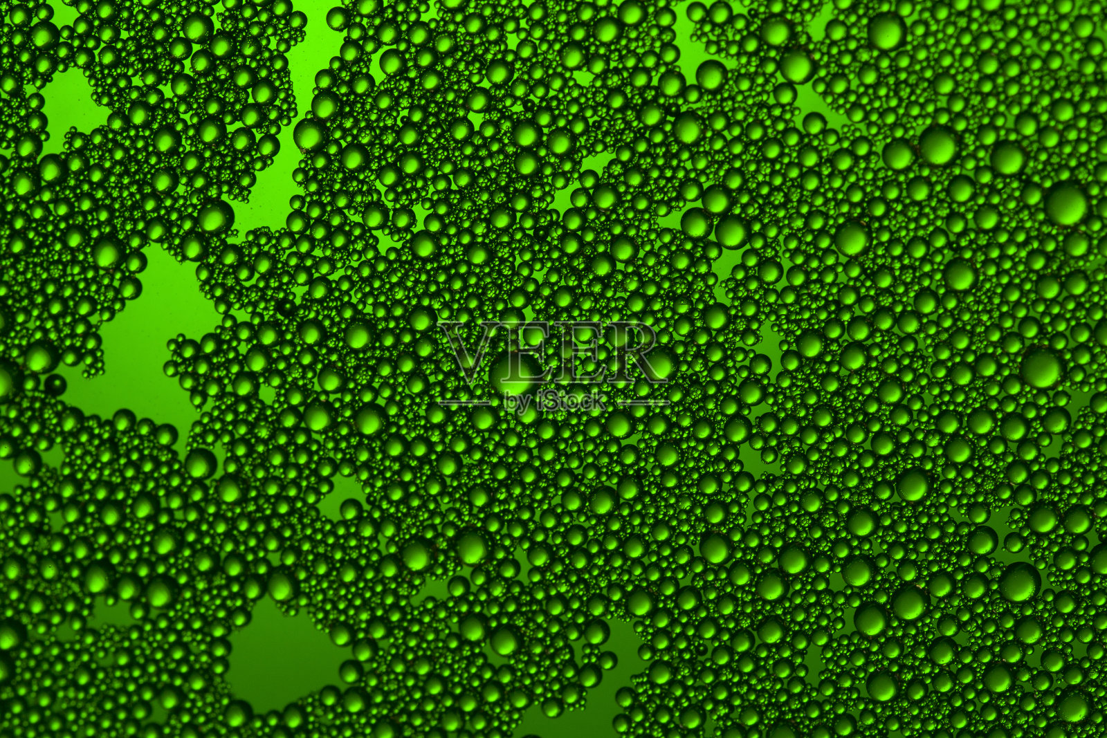 绿色水滴背景。近距离微距拍摄照片摄影图片