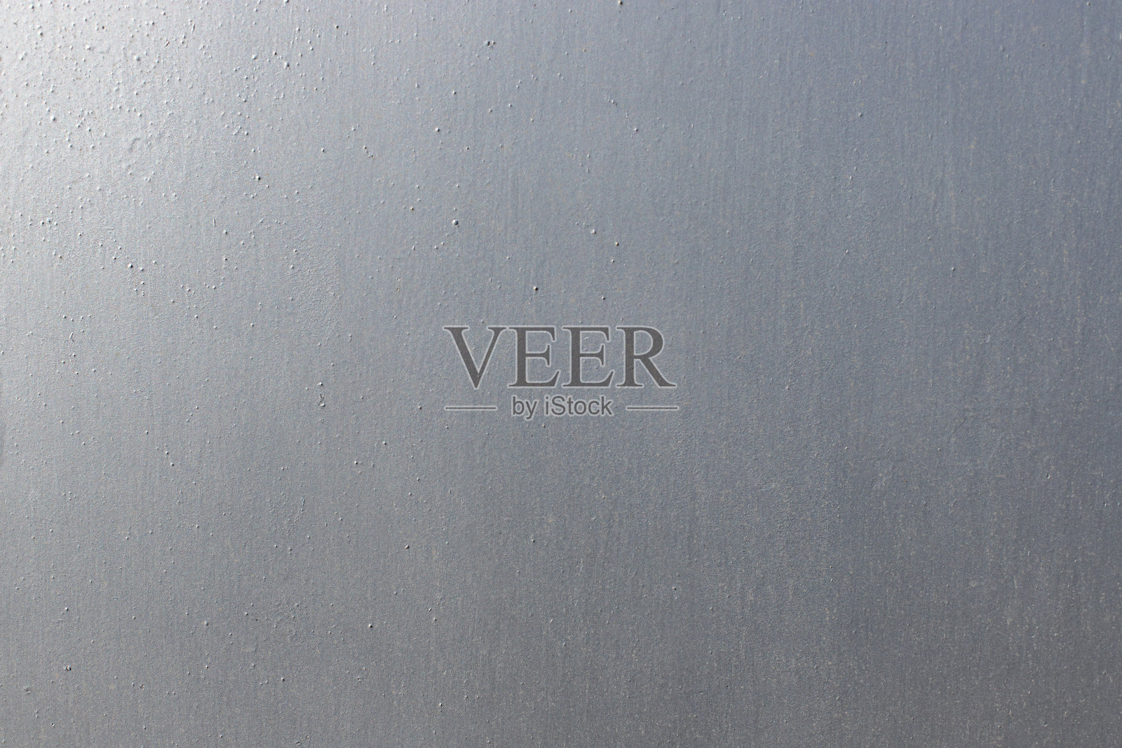 漆成灰色的金属片表面。照片摄影图片