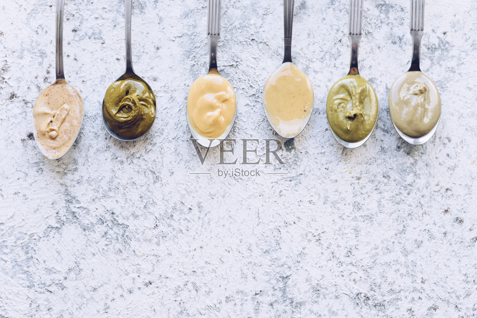 坚果和种子黄油勺照片摄影图片