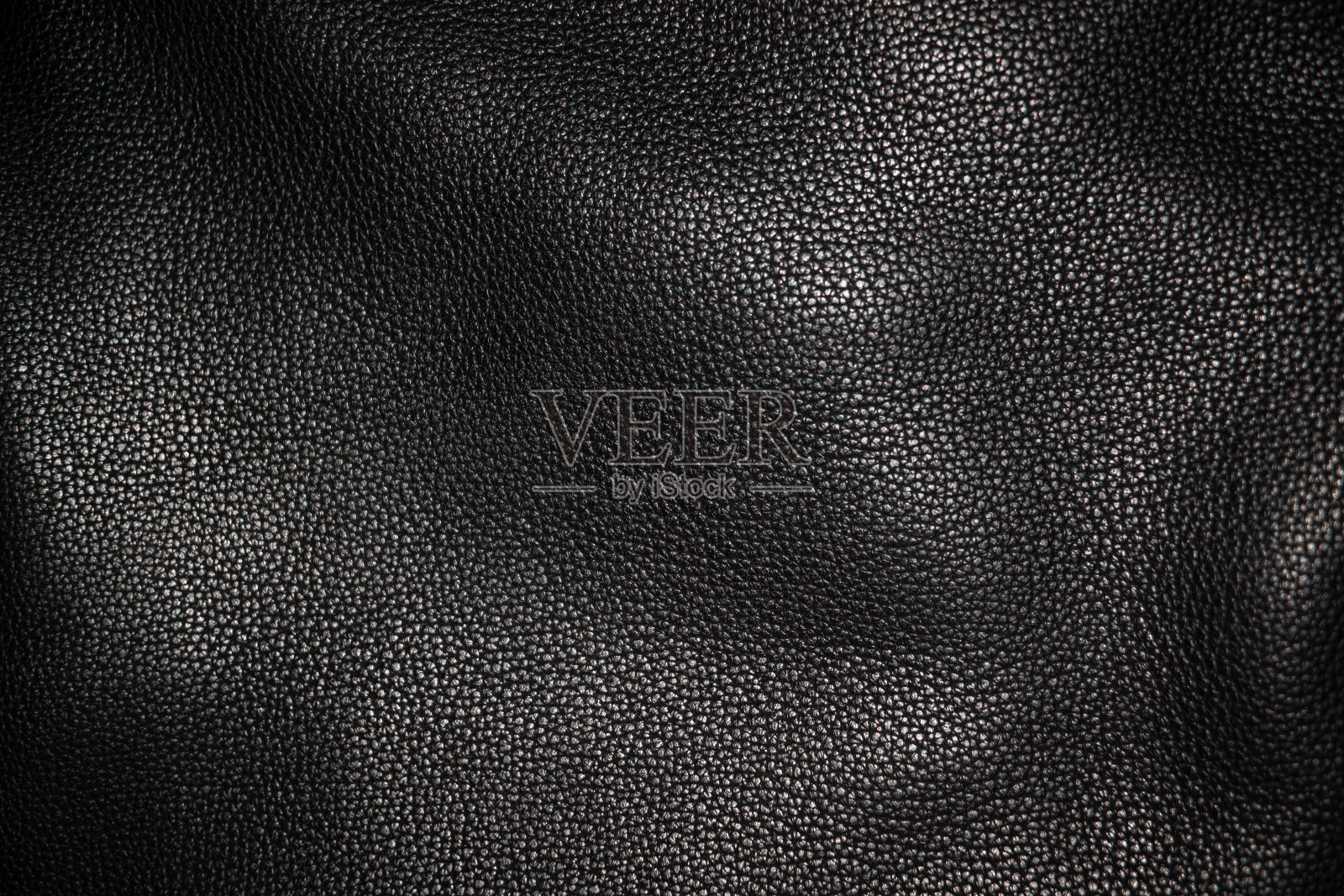 黑色背景的皮革纹理照片摄影图片