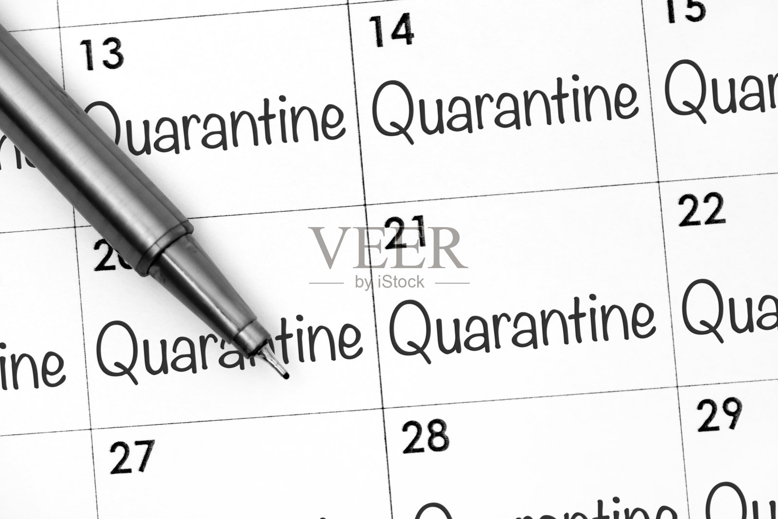 带有“用钢笔隔离”字样的日历页。照片摄影图片