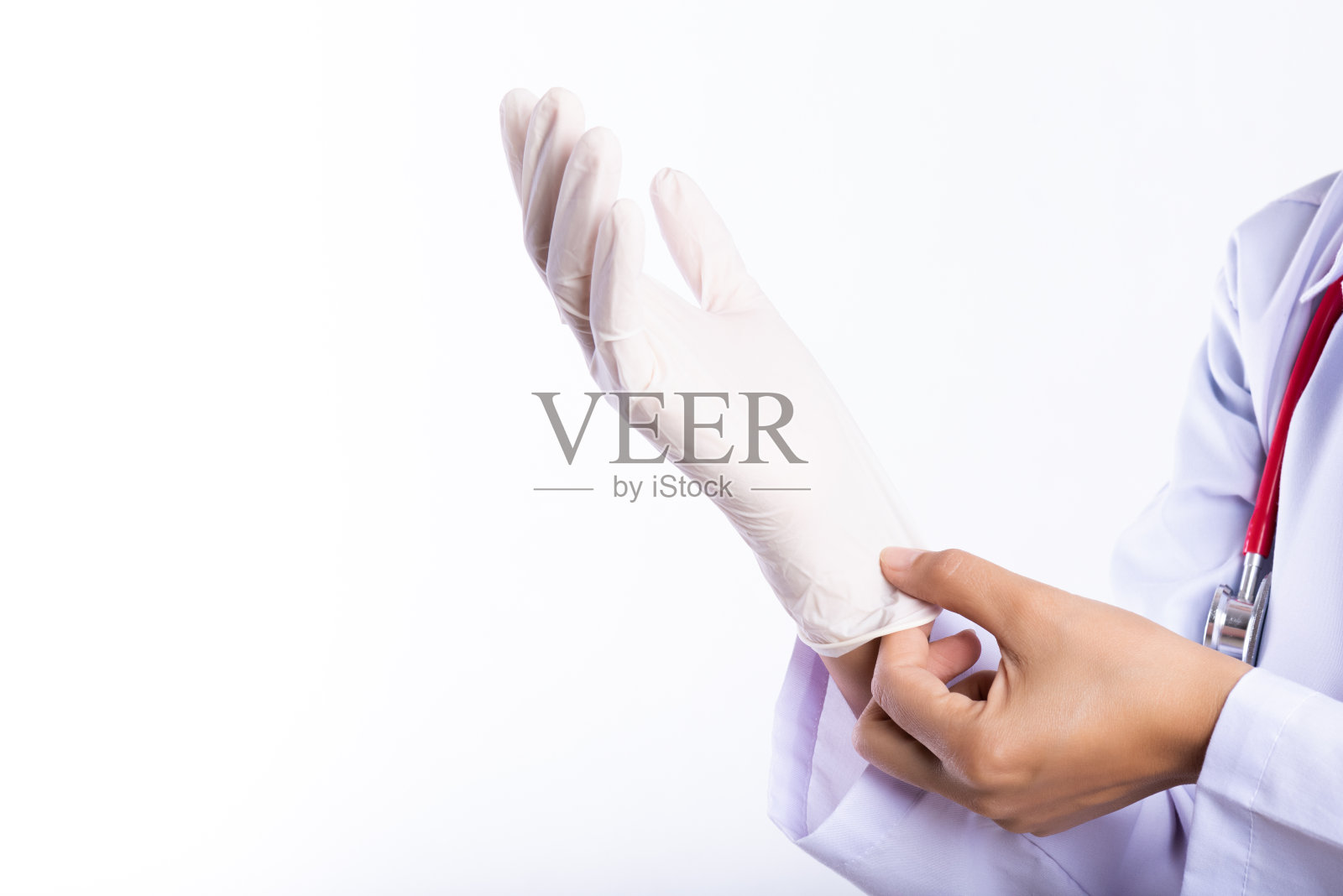 女医生肩戴听诊器，戴无菌手套。医疗保健和医疗概念。照片摄影图片