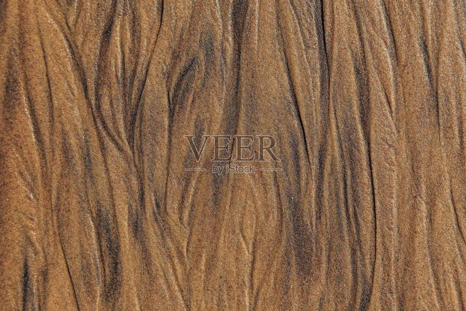 海沙的纹理上有污点的痕迹照片摄影图片