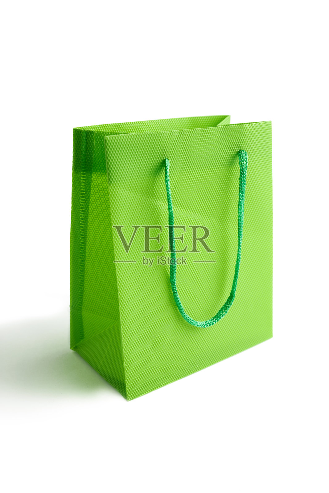 浅绿色袋子模型的设计孤立在白色的背景。空间的文本。销售的概念。照片摄影图片