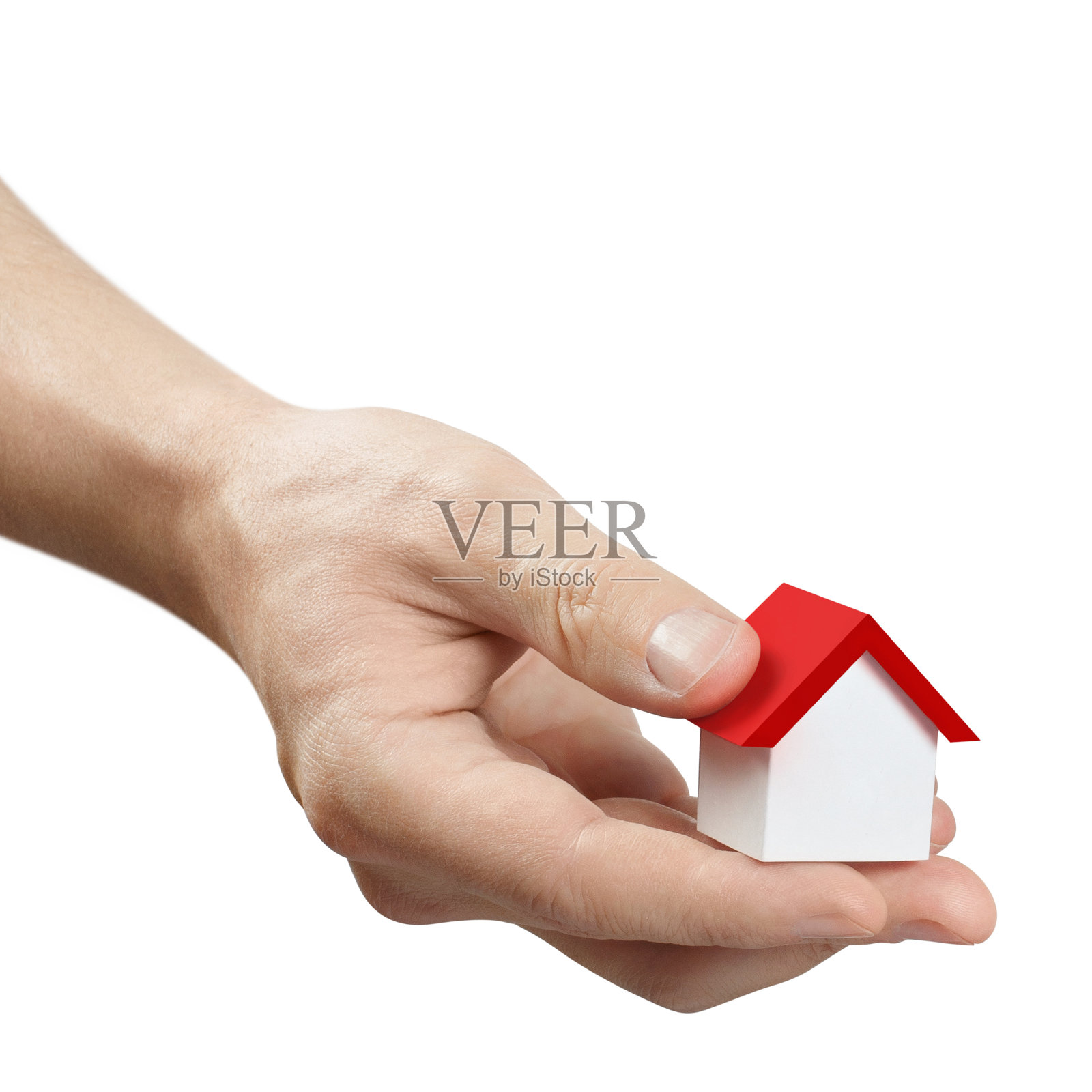 手拿一个白色的玩具房子照片摄影图片