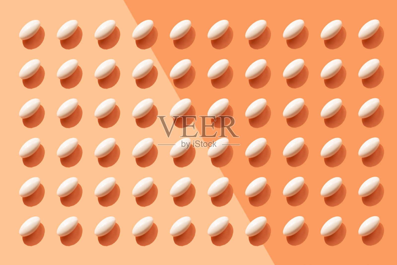 重复药丸，橙色背景照片摄影图片
