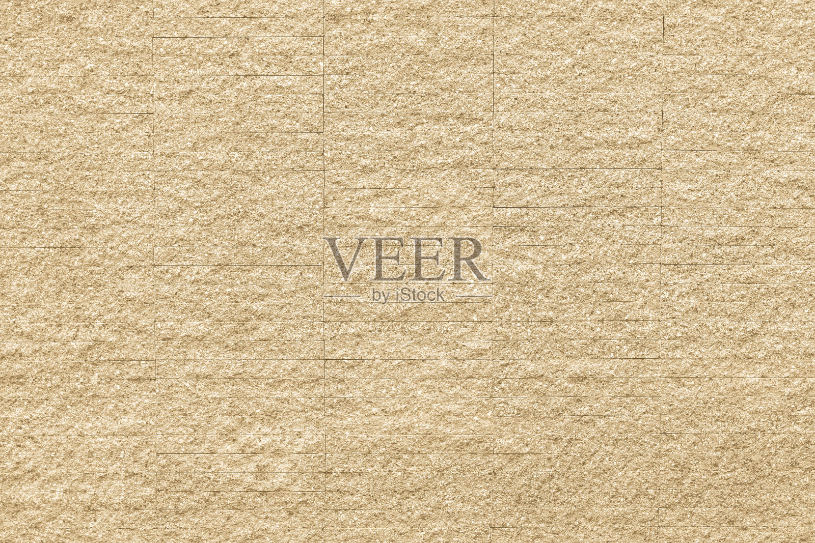 花岗岩瓷砖墙面背景纹理粗糙，自然淡黄奶油色照片摄影图片